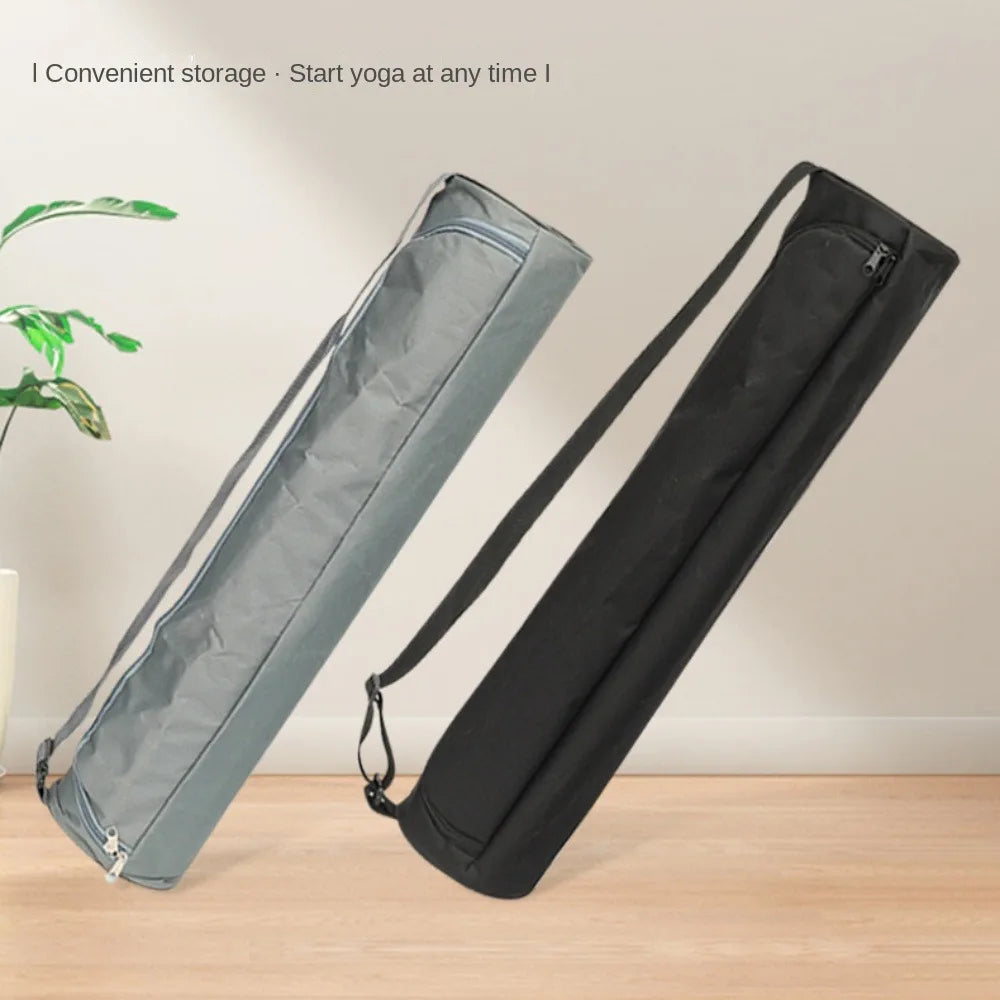 Two yoga mats in carrying cases on a wooden floor with a plant in the background.