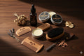 Collection of beard care products including bottles, jars, and tools on a white background