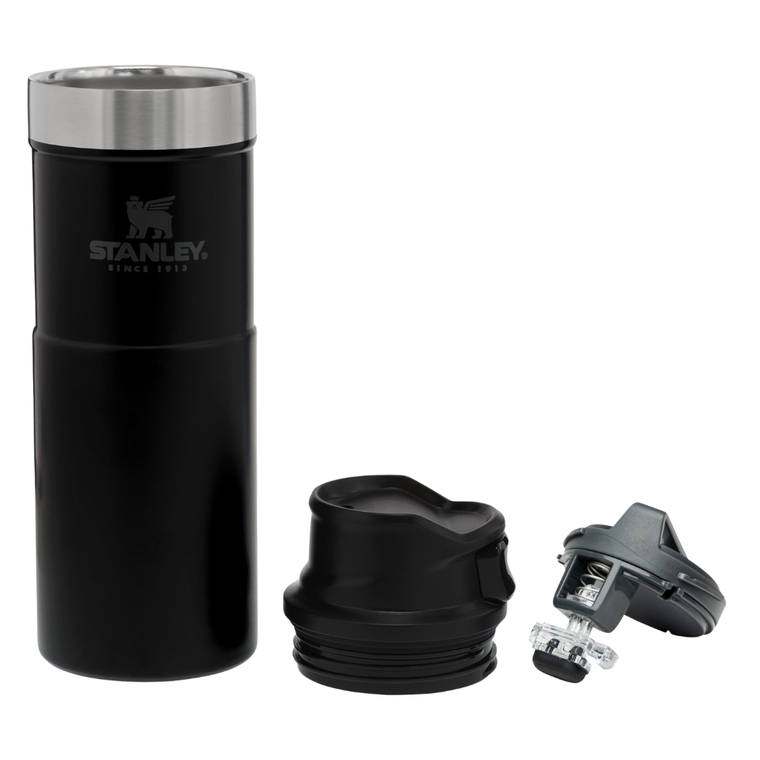 Black Stanley travel mug with two lids on a white background