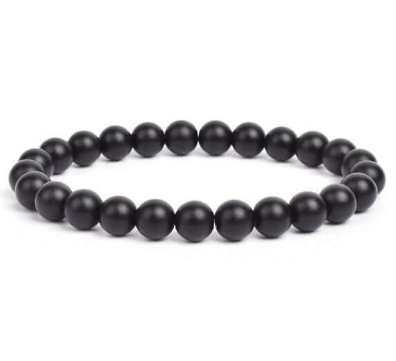 Black beaded bracelet on a white background