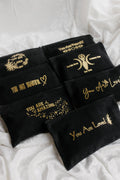 Black headbands with gold text and designs on a white background with affirmation
