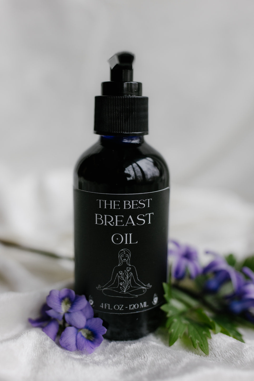 Organic breast massage oil bottle by Velvet Bloom Beauty & Wellness — lymphatic drainage and self-care ritual oil"