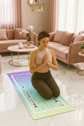 Woman practicing yoga on a colorful mat in a minimalistic room.