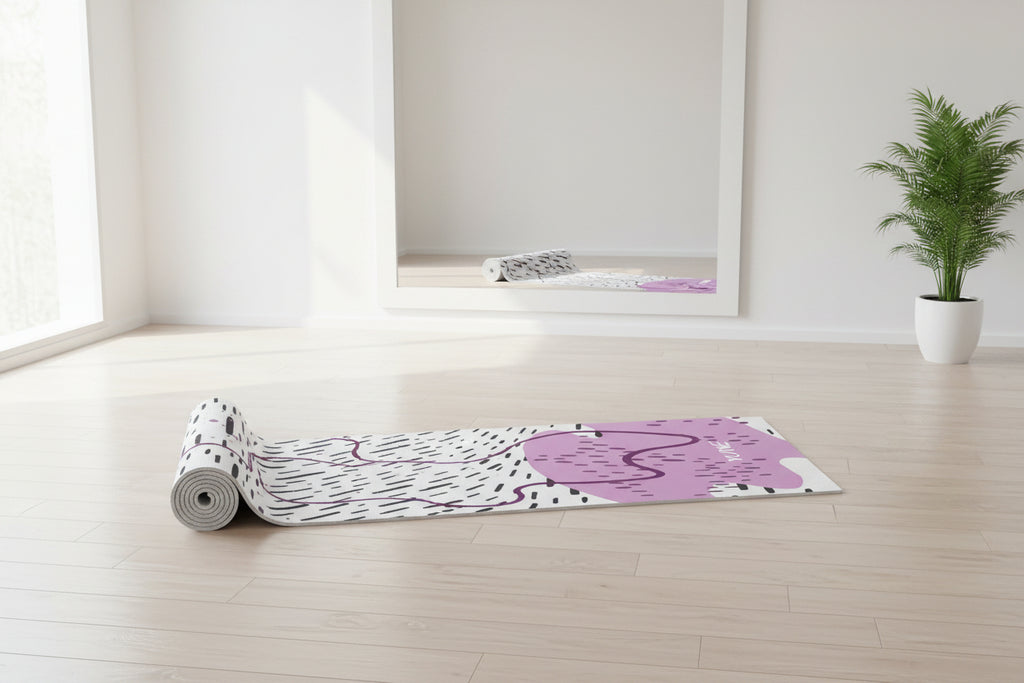 Yoga mat with abstract design and 'YUNI' branding on a white background