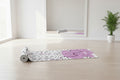 Yoga mat with abstract design and 'YUNI' branding on a white background
