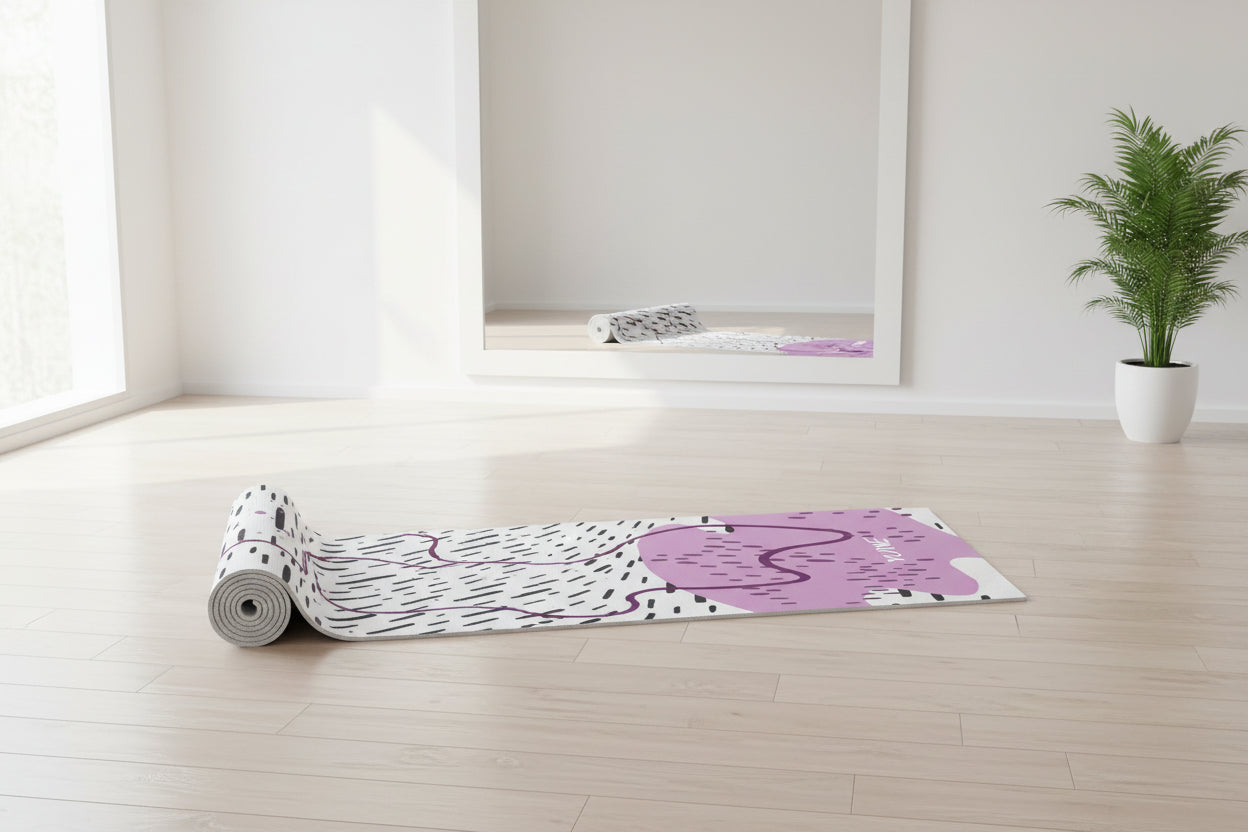 Yoga mat with abstract design and 'YUNI' branding on a white background