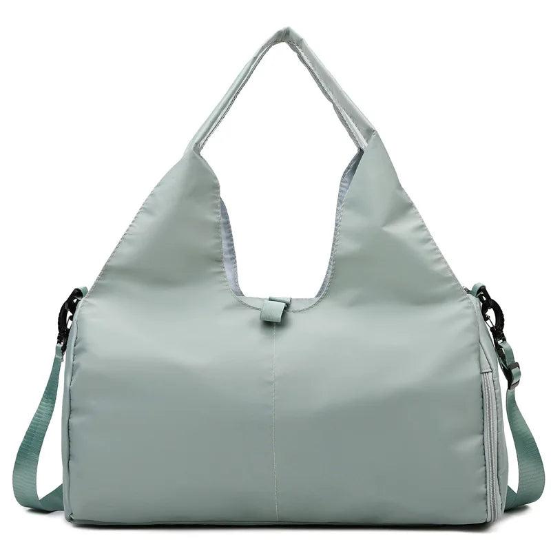 Light gray handbag with a shoulder strap on a white background